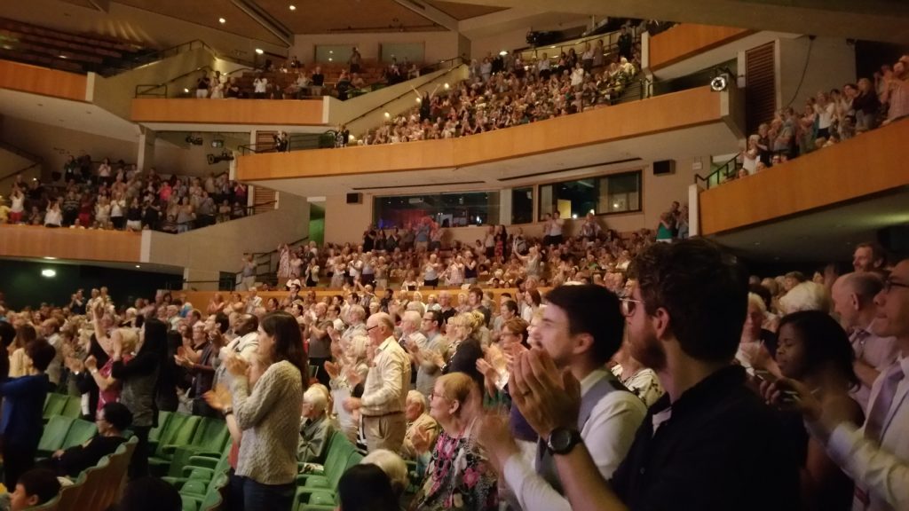 Audience joining in to the music
